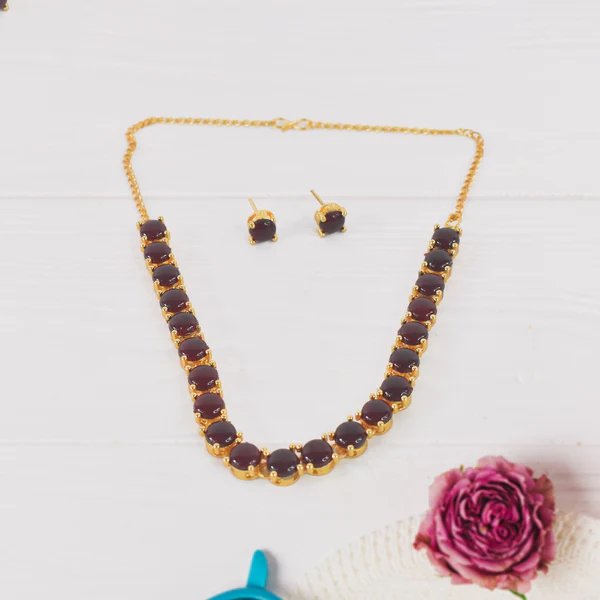 Kollam Supreme Gold-Plated Brass Red American Diamond Stone Necklace Set ? Luxurious Jewelry for Women